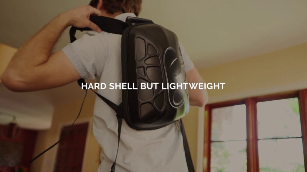Man carrying Hardshell but lightweight technology backpack